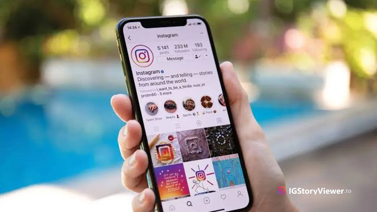 A hand holding a phone showing an Instagram profile page, representing checking someone's Instagram activity
