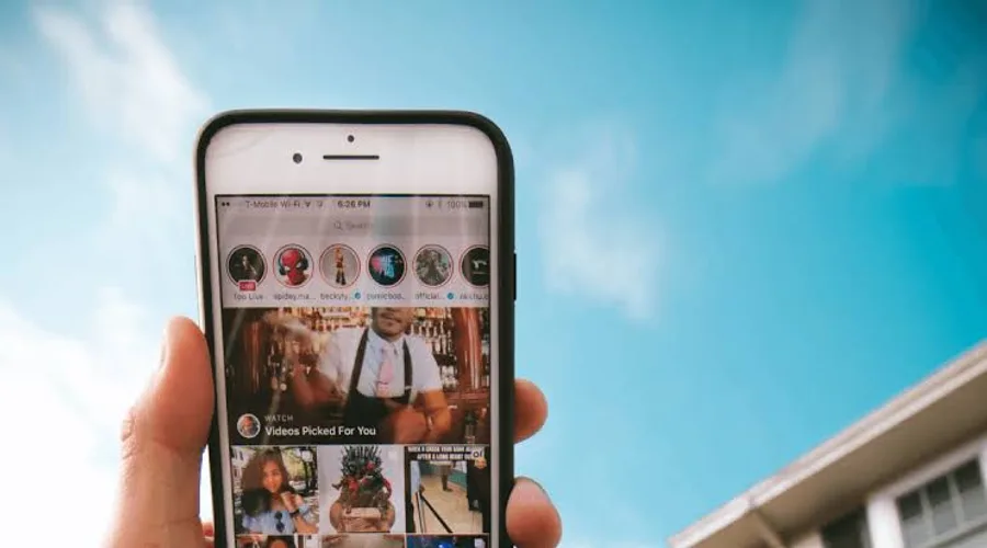 Person holding a phone viewing Instagram stories